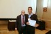 Dr. Nagib Callaos, General Chair, giving Dr. Imran Ahmad the best paper award certificate of the session "Computer Science and Engineering." The title of the awarded paper is "Real-Time Sentimental Polarity Classification on Live Social-Media."